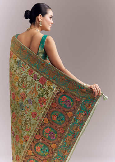 Mint Green Dola Silk Woven Saree With Embroidered Nature Motifs Mint Green Dola Silk Woven Saree With Embroidered Nature Motifs