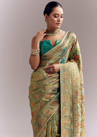 Mint Green Dola Silk Woven Saree With Embroidered Nature Motifs Mint Green Dola Silk Woven Saree With Embroidered Nature Motifs