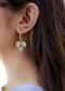 Mother Of Pearl Earrings Hanged In A Gold Design Hoop