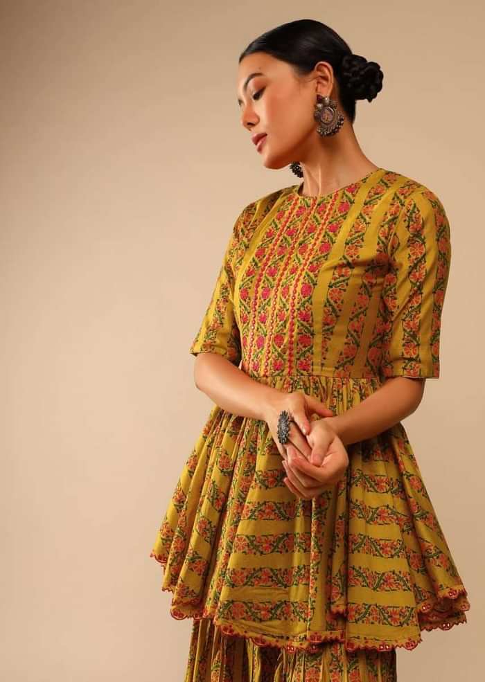 Mustard Sharara Suit In Cotton Blend With Peplum Kurti Adorned In Floral Print And Thread Embroidery