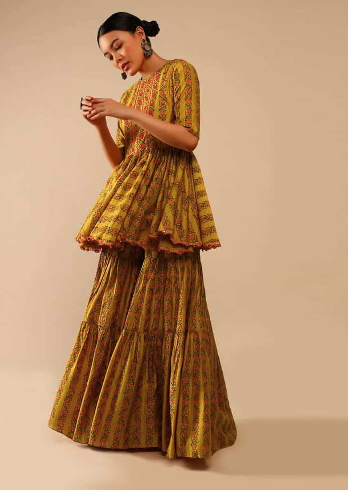 Mustard Sharara Suit In Cotton Blend With Peplum Kurti Adorned In Floral Print And Thread Embroidery