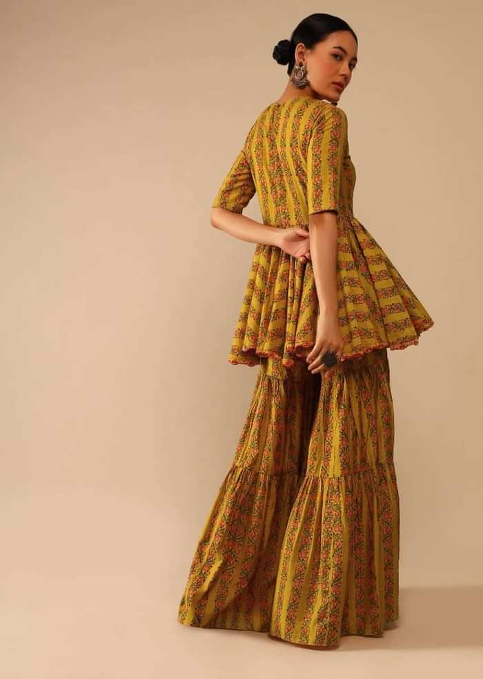 Mustard Sharara Suit In Cotton Blend With Peplum Kurti Adorned In Floral Print And Thread Embroidery