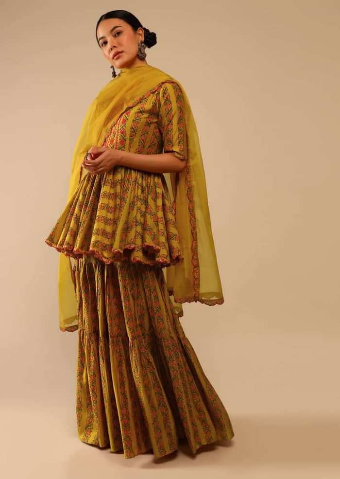 Mustard Sharara Suit In Cotton Blend With Peplum Kurti Adorned In Floral Print And Thread Embroidery