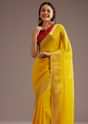 Mustard Yellow Crepe Silk Saree With Zari Border And Contrast Blouse