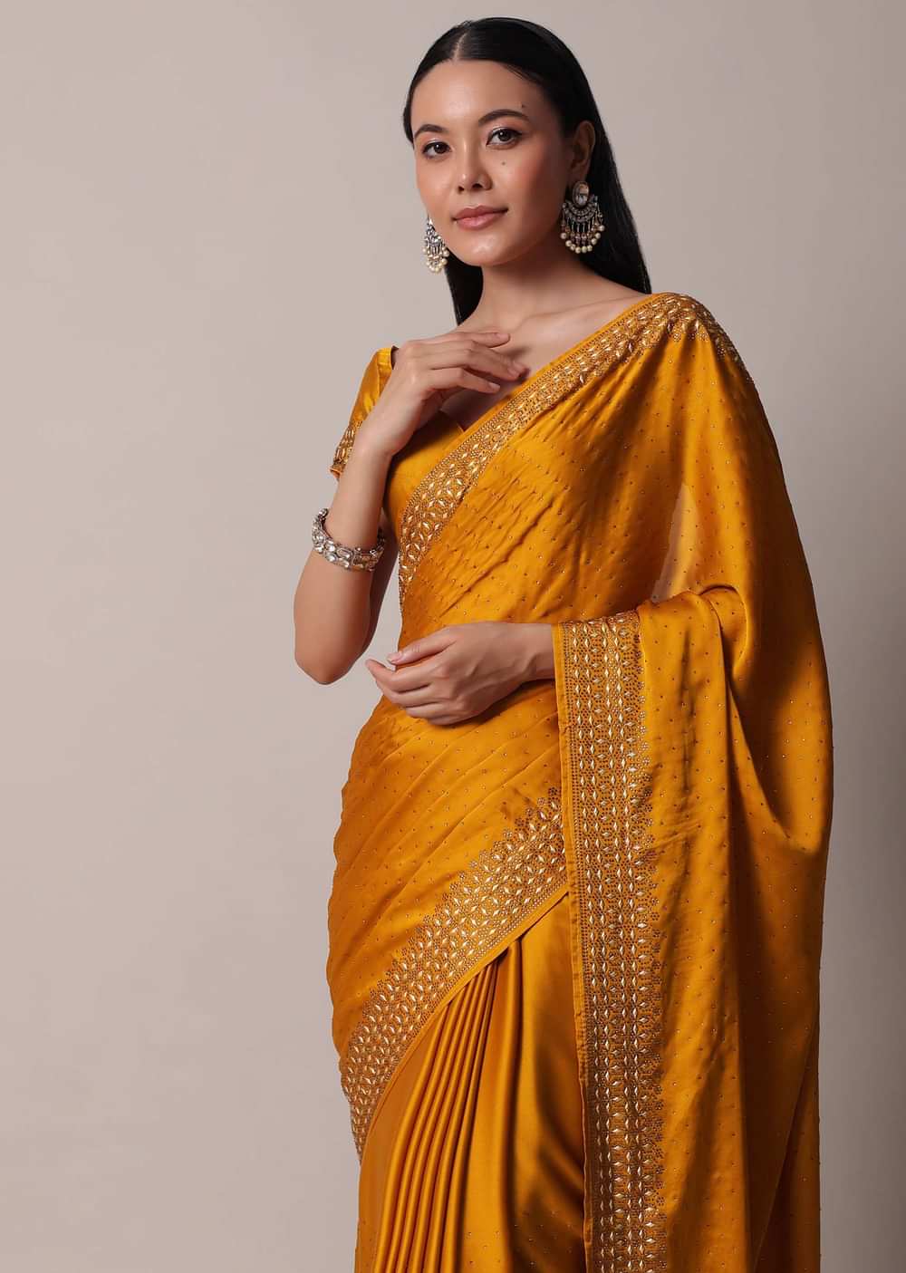 Mustard Satin Saree With Gold Tone Embellishments And Unstitched Blouse Piece