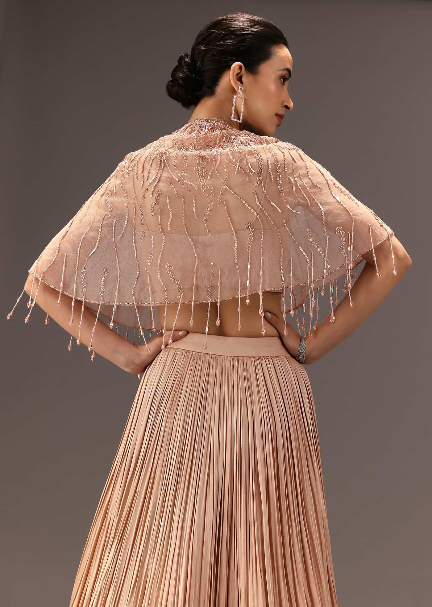 Nude Ruched Blouse With Cape And Layered Skirt