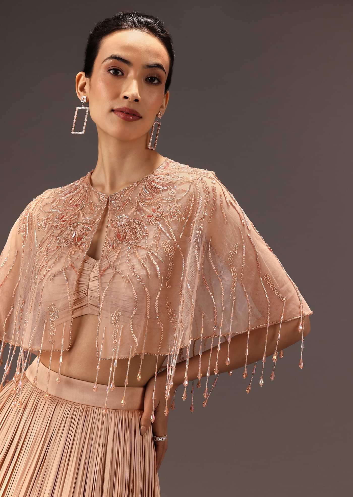Nude Ruched Blouse With Cape And Layered Skirt
