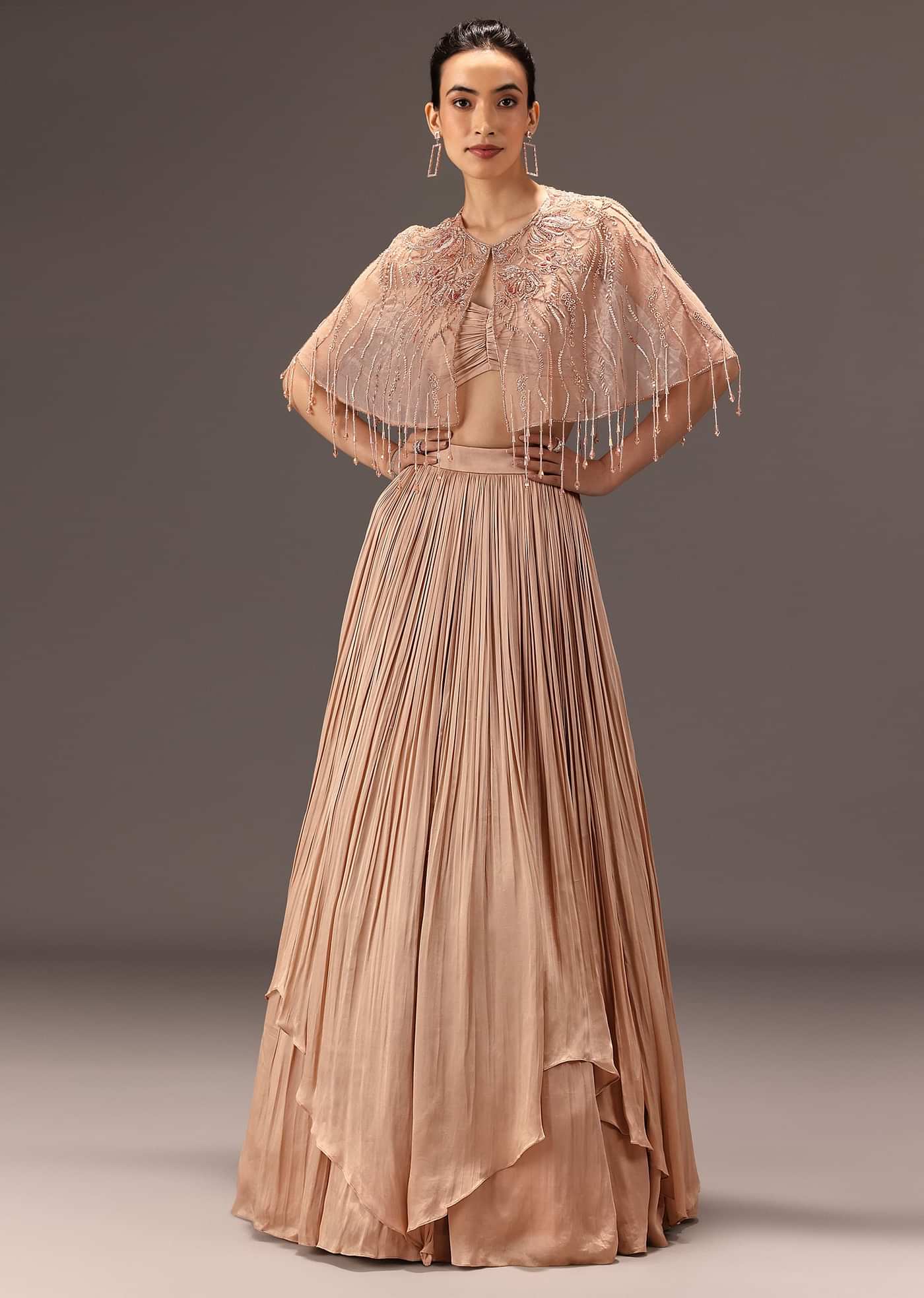 Nude Ruched Blouse With Cape And Layered Skirt