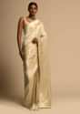 Beige Banarasi Saree In Pure Handloom Silk With Woven Floral Jaal And Floral And Checks Border Along With Unstitched Blouse Piece