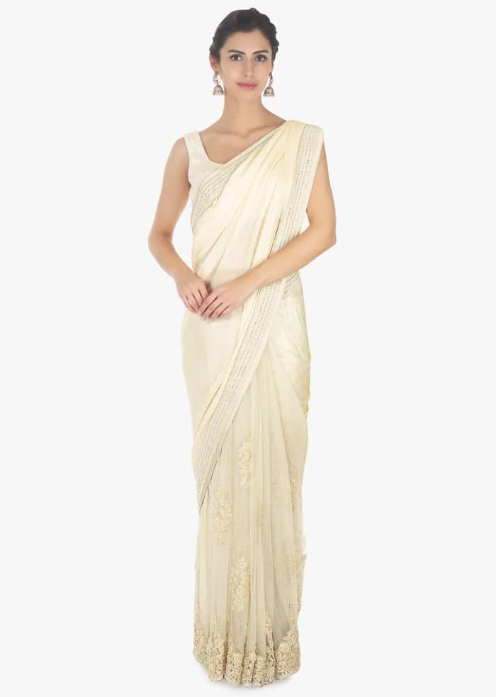 Off white half and half saree in chiffon and net saree with embellished scallop border only on Kalki