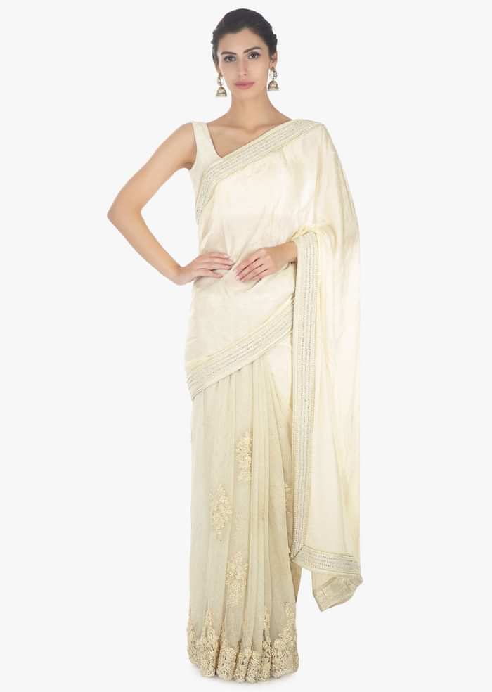 Off white half and half saree in chiffon and net saree with embellished scallop border only on Kalki