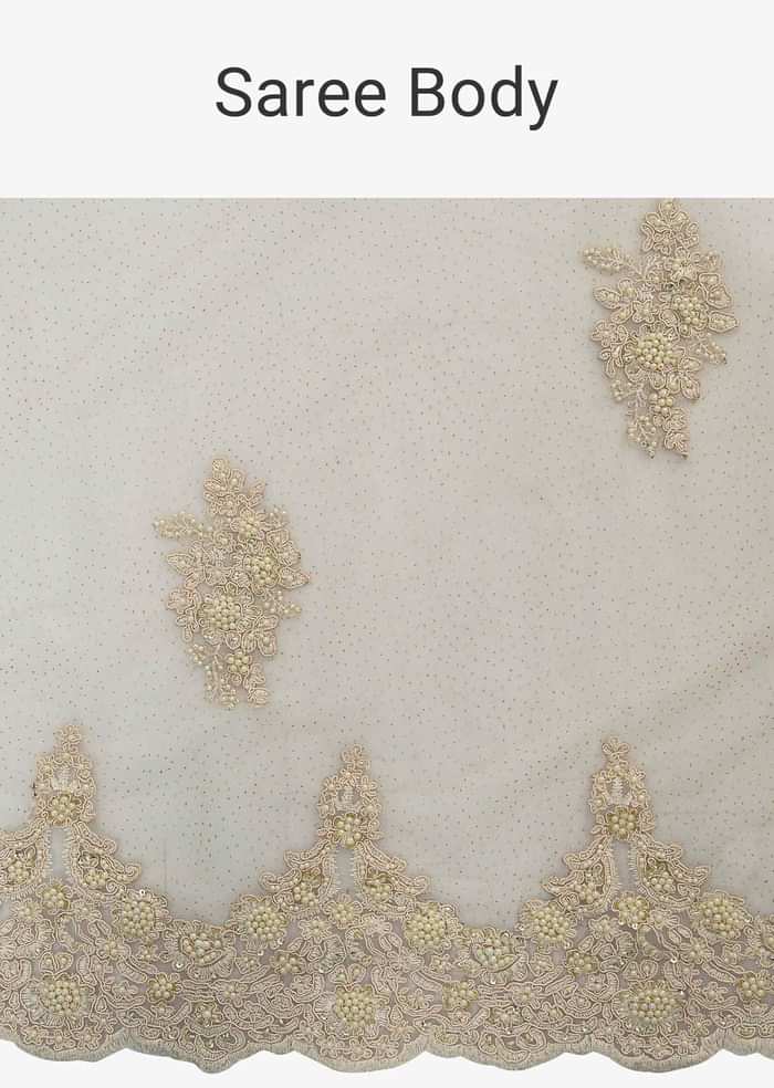 Off white half and half saree in chiffon and net saree with embellished scallop border only on Kalki
