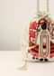 Off White Potli In Raw Silk With Hand Embroidered Goddess Motif Using Multi Colored Thread, Moti And Stone