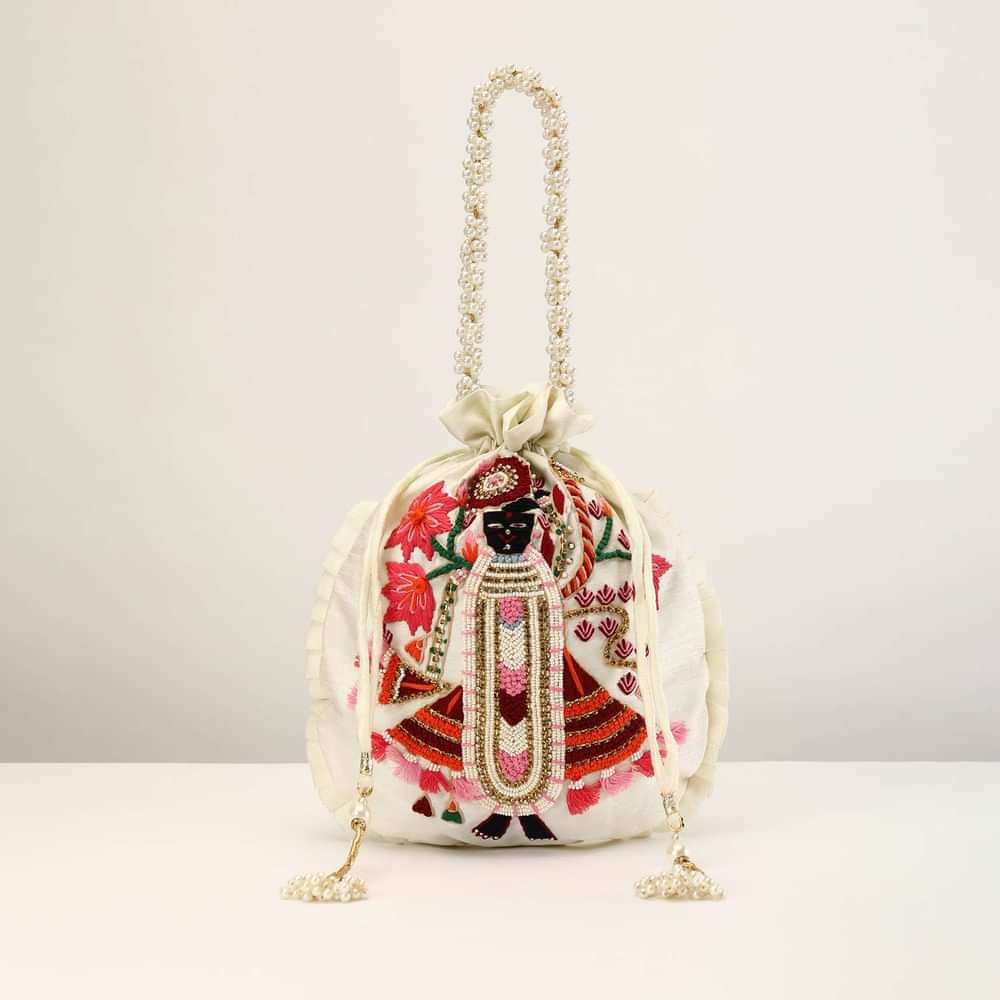Off White Potli In Raw Silk With Hand Embroidered Goddess Motif Using Multi Colored Thread, Moti And Stone