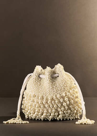 Off White Potli With Pearl Work Off White Potli With Pearl Work