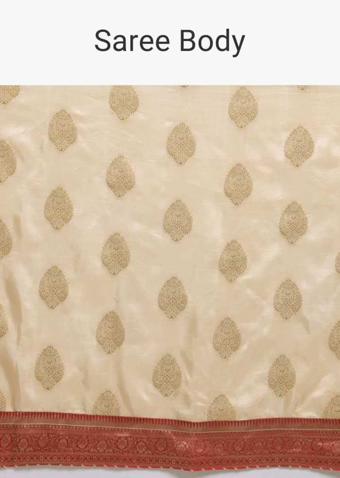 Off White Saree In Dola Silk With Brocade Leaf Shaped Buttis And Contrast Red Bandhani Border