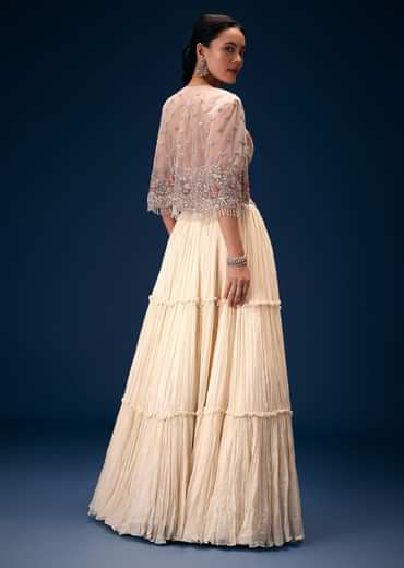Off White Tiered Lehenga With Embroidered Corset Blouse And Embroidered Cape