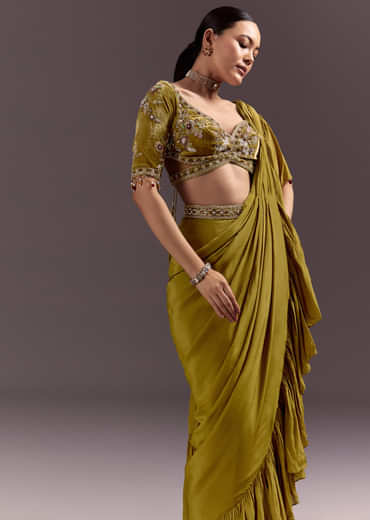 Olive Green Velvet Saree With Frilled Pallu And Heavy Embroidered Blouse