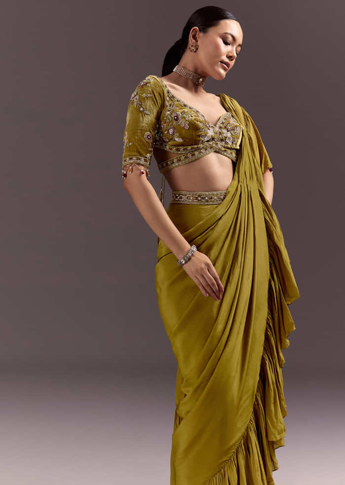 Olive Green Velvet Saree With Frilled Pallu And Heavy Embroidered Blouse