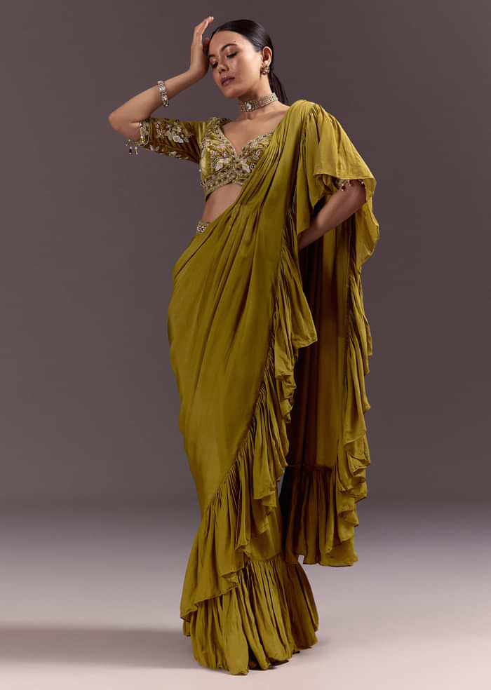 Olive Green Velvet Saree With Frilled Pallu And Heavy Embroidered Blouse