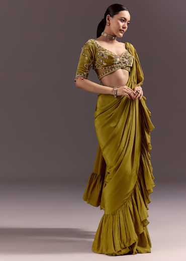 Olive Green Velvet Saree With Frilled Pallu And Heavy Embroidered Blouse