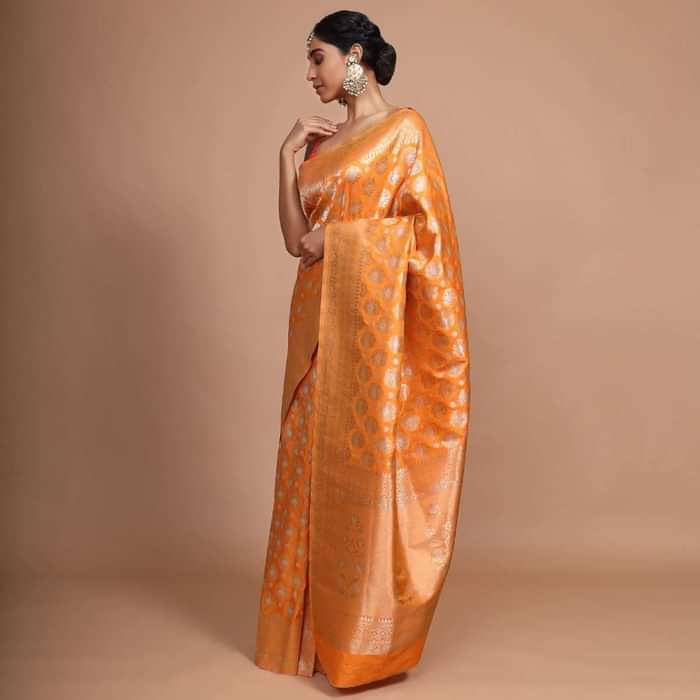 Orange art handloom Saree In Silk With Weaved Floral Buttis