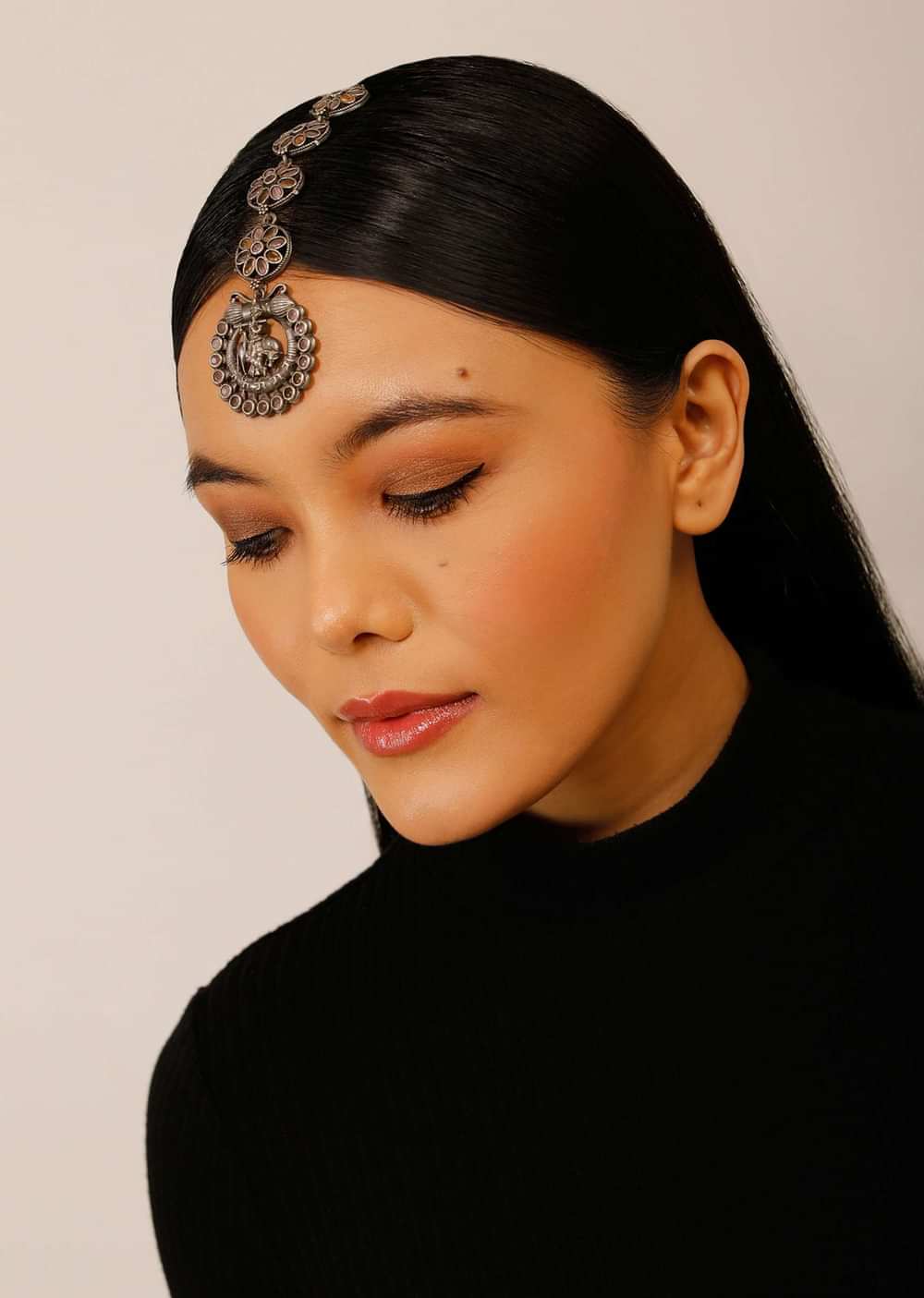 Oxidised Silver Mangtika With Carved Lord Krishna Motif And Studded In Lavender Stones
