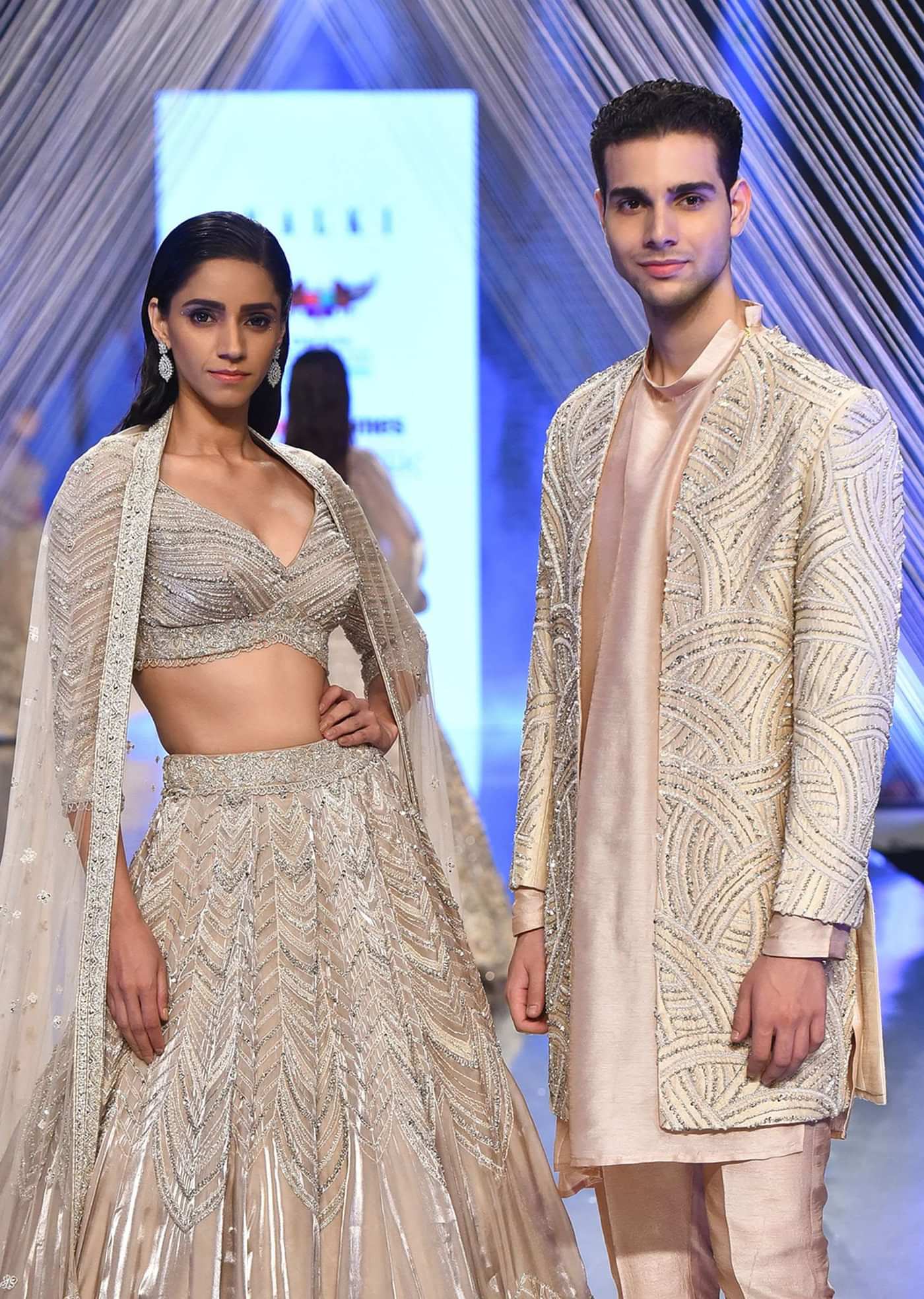 Oyster Organza Lehenga With Cut Dana Embroidery, Crop Top Comes In 3/4Th Sleeves With A Deep V Neckline