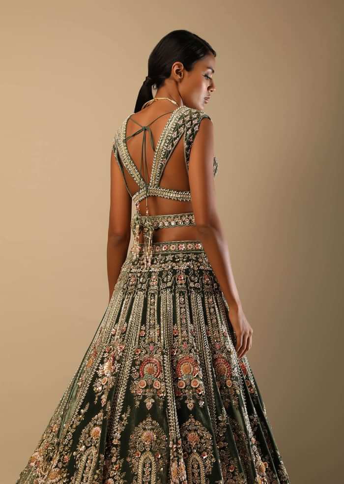 Palace Green Lehenga Choli In Velvet With Multi Colored Hand Embroidered Heritage Kalis With Hints Of Flowers