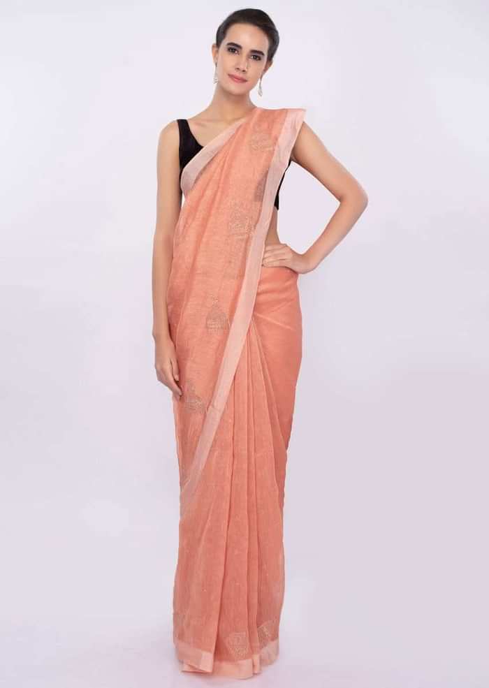 Pale orange linen saree with self moti embroidery and butti only on Kalki