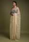 Parchment White Saree In Net With Weaved Golden Floral Motifs And Kundan Work Online - Kalki Fashion