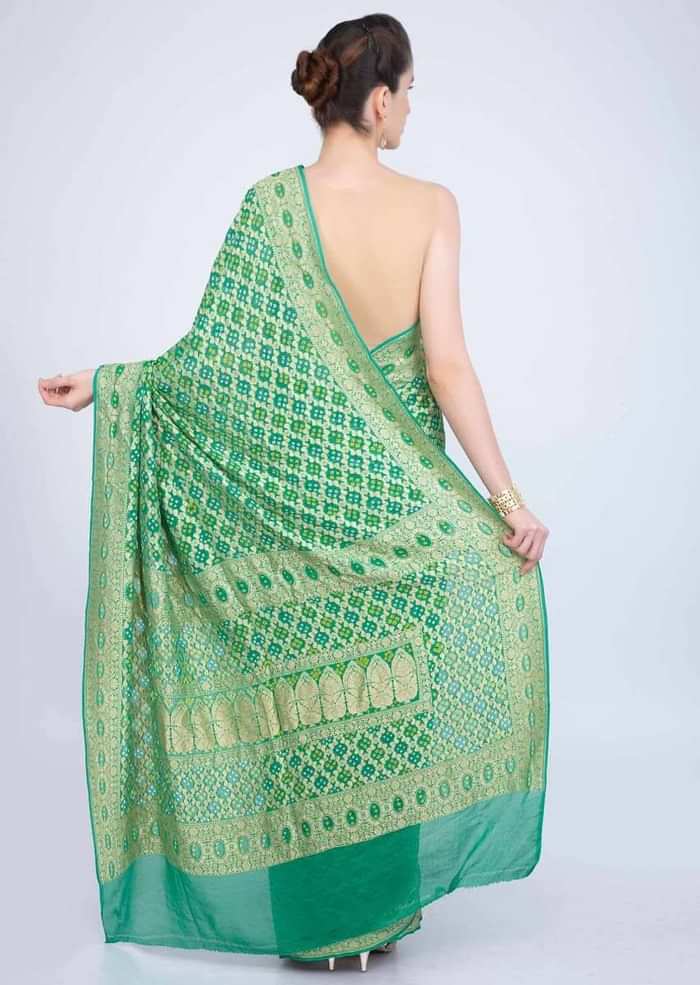 Paris green bandhani printed saree with weaved jaal work  only on kalki