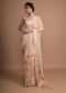 Pastel Peach Saree With Weaved Border And Beautiful Resham Embroidered Floral Buttis Online - Kalki Fashion