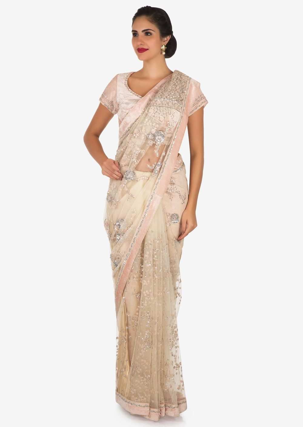 Pastel hued saree in net with velvet blouse adorn in heavy sequin and thread embroidered work only on Kalki