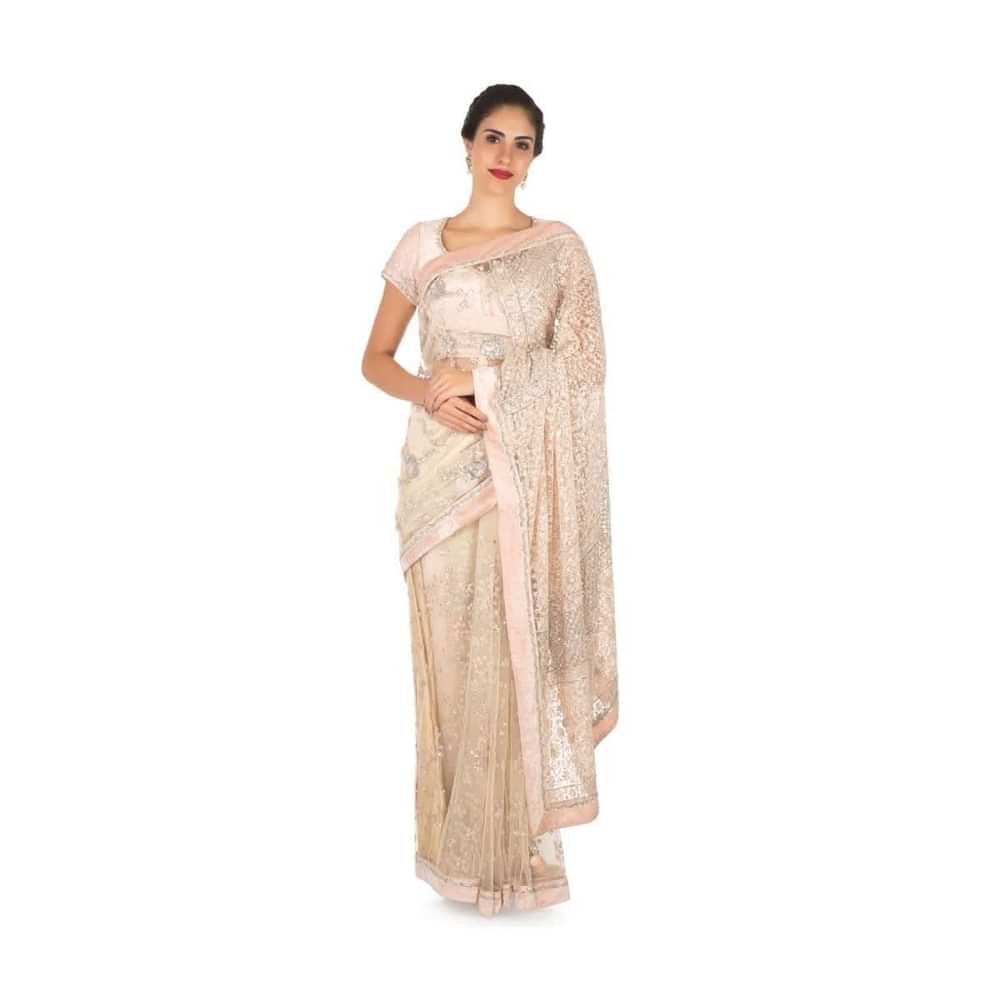 Pastel hued saree in net with velvet blouse adorn in heavy sequin and thread embroidered work only on Kalki