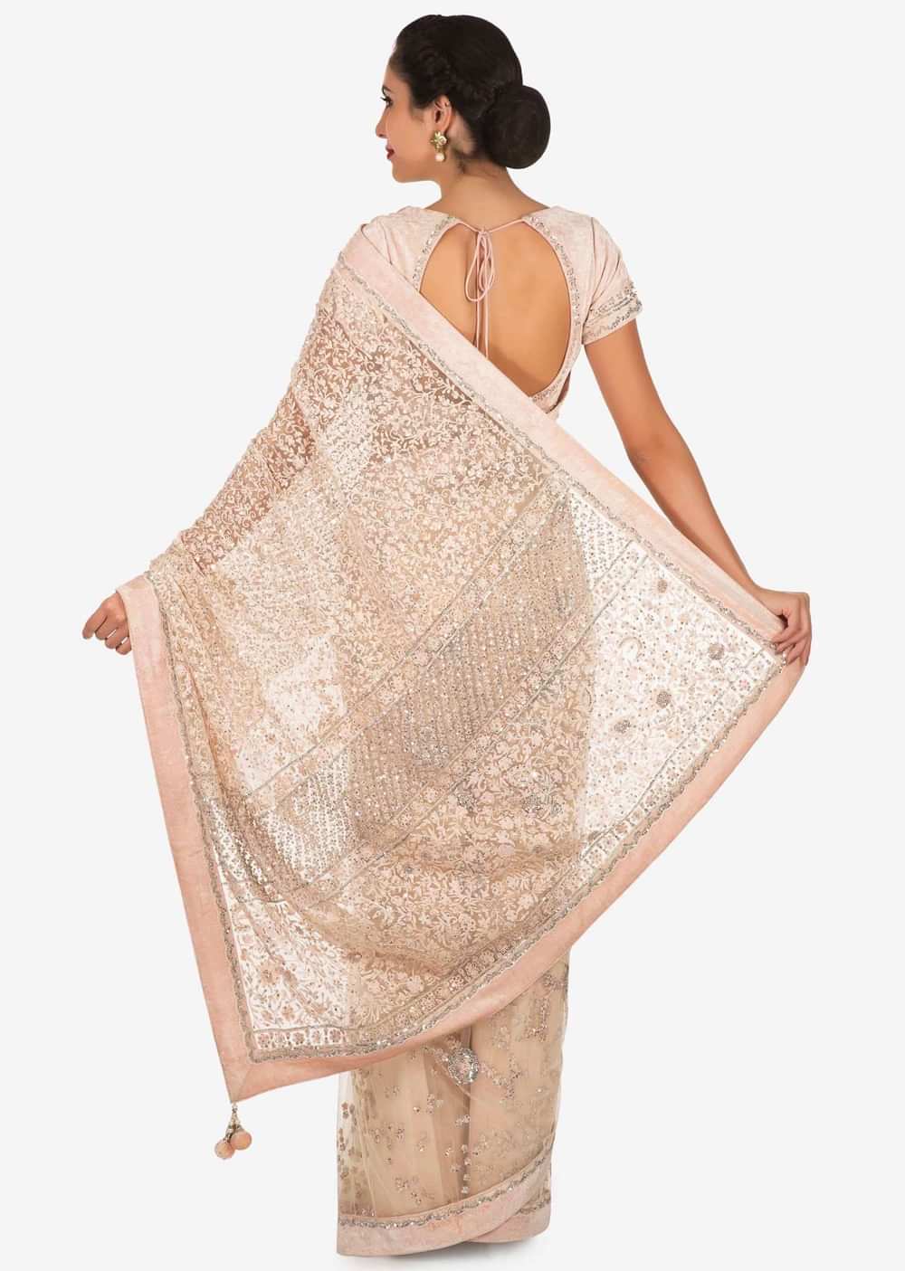 Pastel hued saree in net with velvet blouse adorn in heavy sequin and thread embroidered work only on Kalki