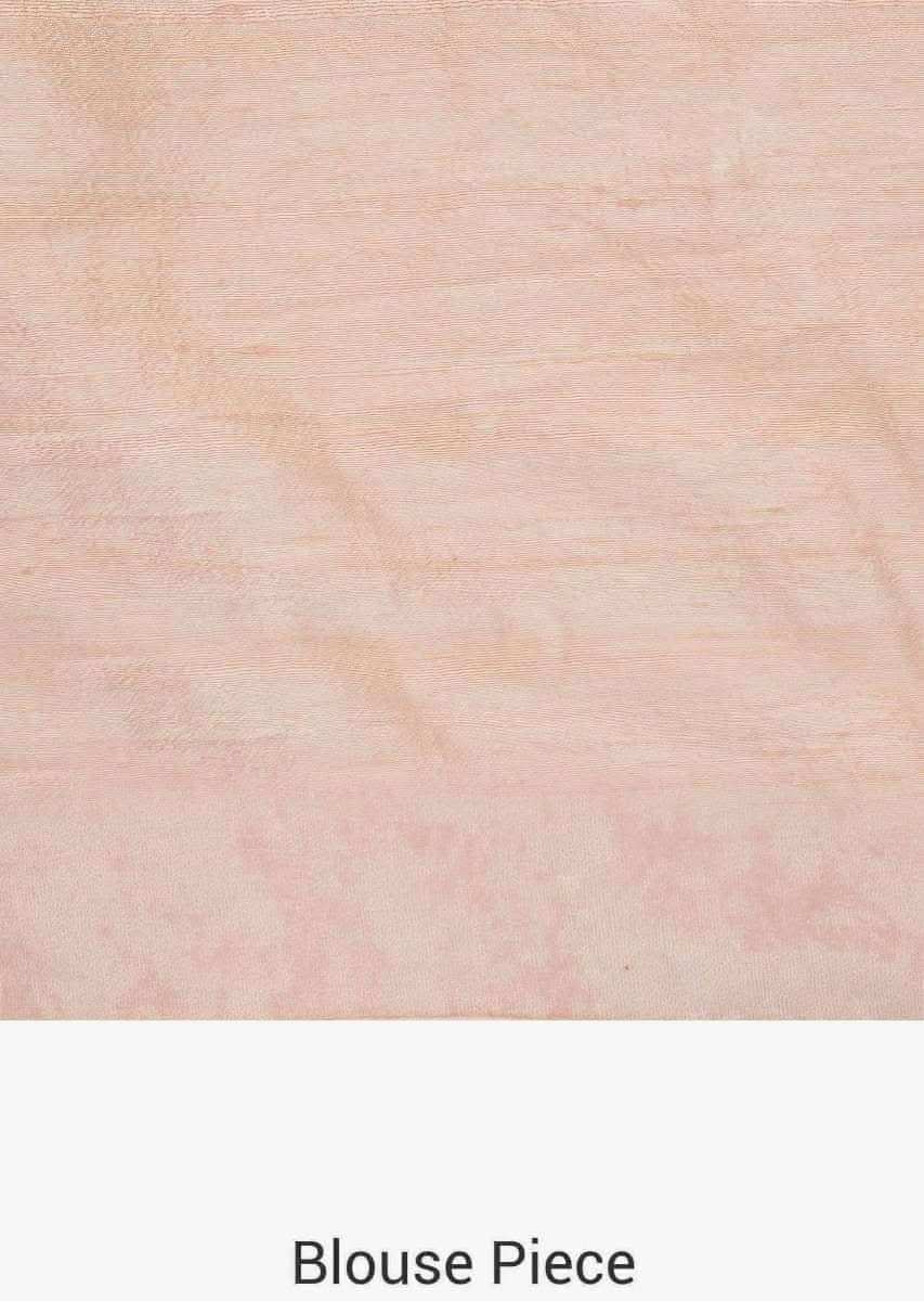 Pastel hued saree in net with velvet blouse adorn in heavy sequin and thread embroidered work only on Kalki
