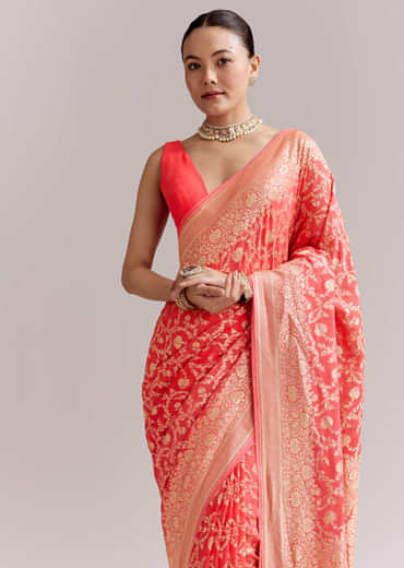 Peach Georgette Woven Saree With Floral Jaal And Heavy Border