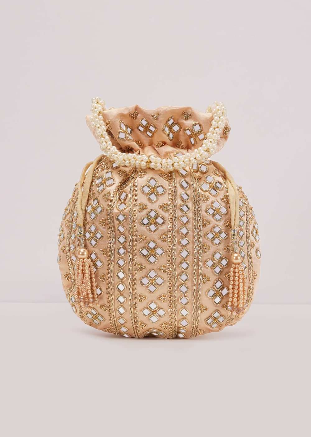 Powder Peach Potli In Satin With Hand Embroidery Detailing Using Mirror And Zardosi In Geometric Design