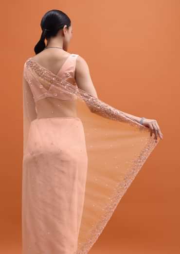 Powder Pink Embroidered Net Saree With Unstitched Blouse