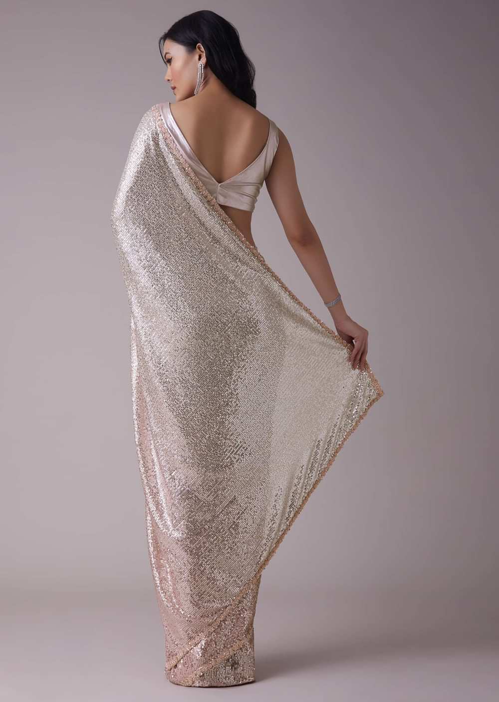 Peach Pink And Silver Toned Sequins Saree With An Embellished Border