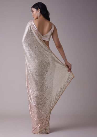 Peach Pink And Silver Toned Sequins Saree With An Embellished Border