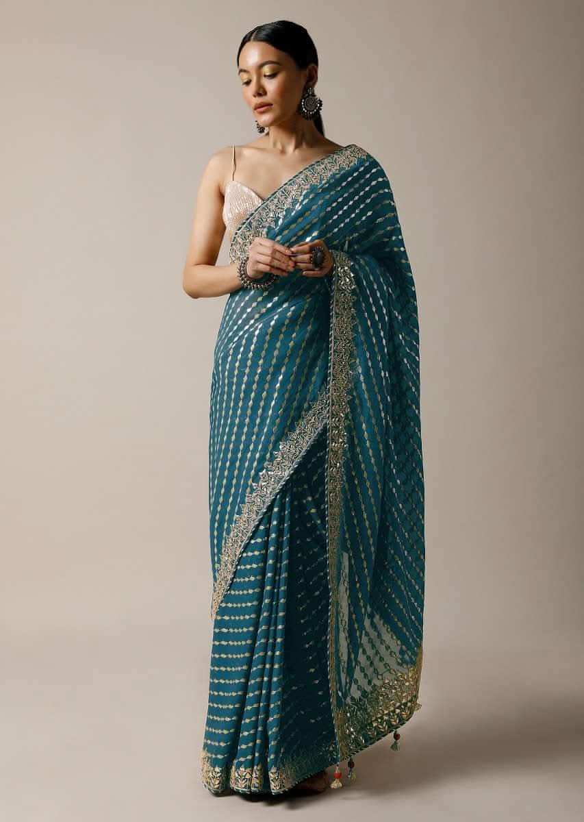 Peacock Green Saree In Brocade Silk With Woven Stripes And Gotta Embroidered Border Along With Unstitched Blouse Online - Kalki Fashion