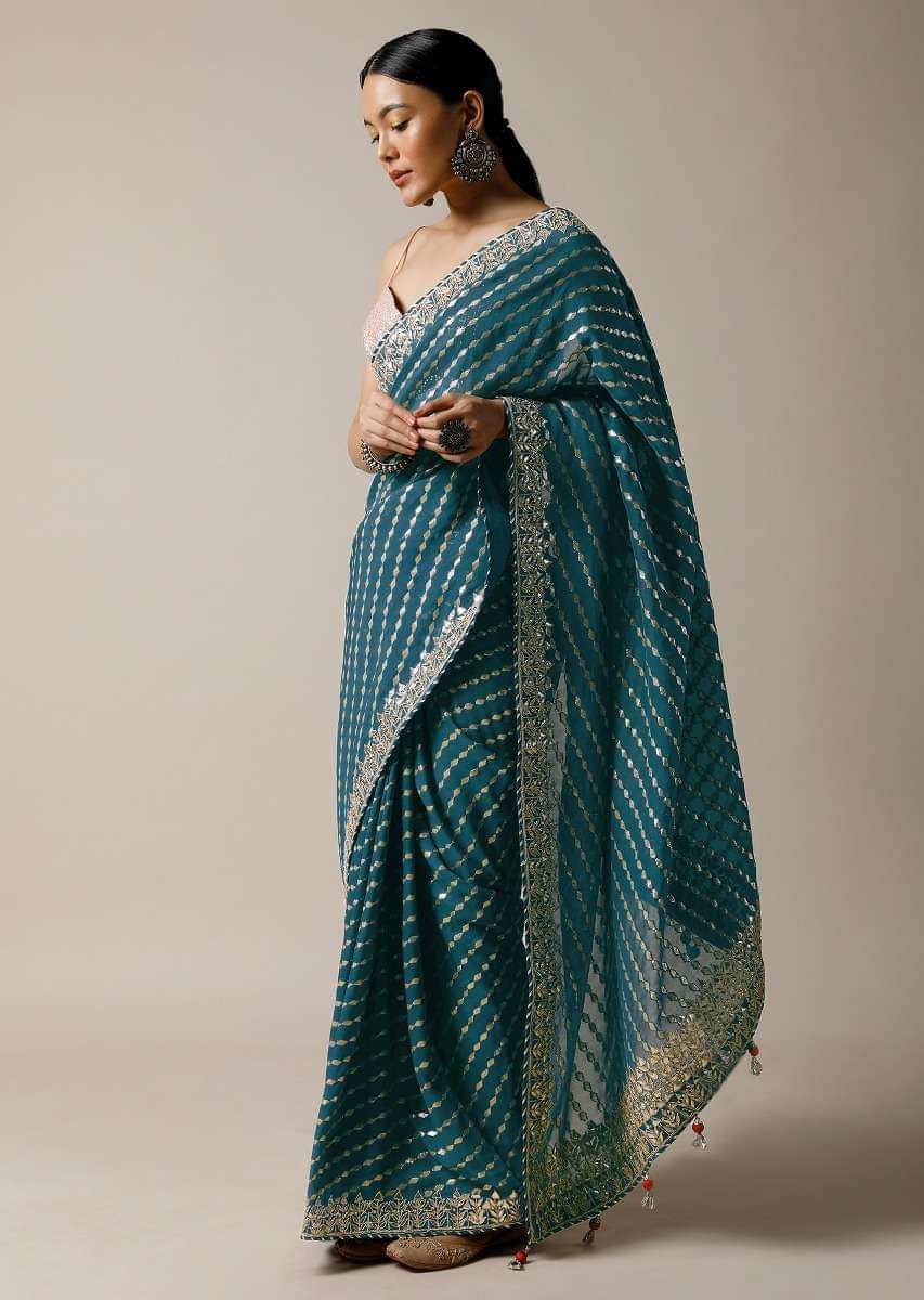 Peacock Green Saree In Brocade Silk With Woven Stripes And Gotta Embroidered Border Along With Unstitched Blouse Online - Kalki Fashion