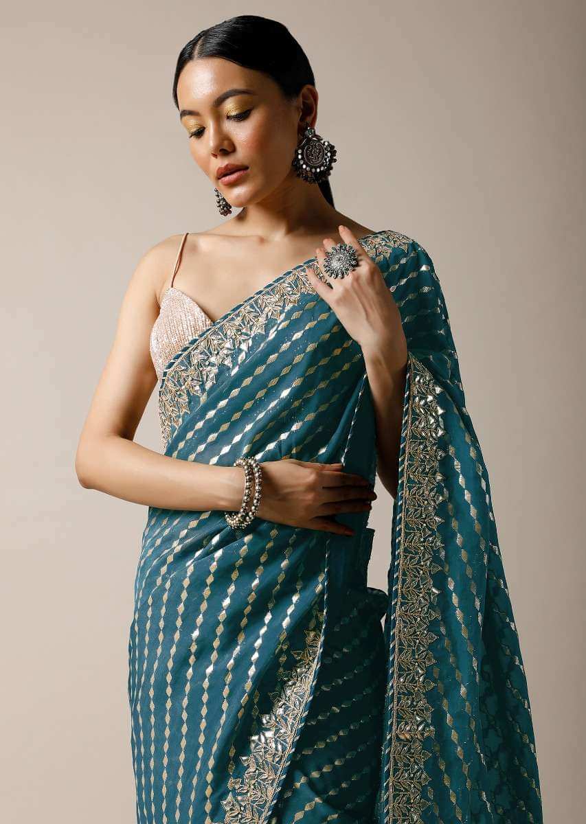 Peacock Green Saree In Brocade Silk With Woven Stripes And Gotta Embroidered Border Along With Unstitched Blouse Online - Kalki Fashion