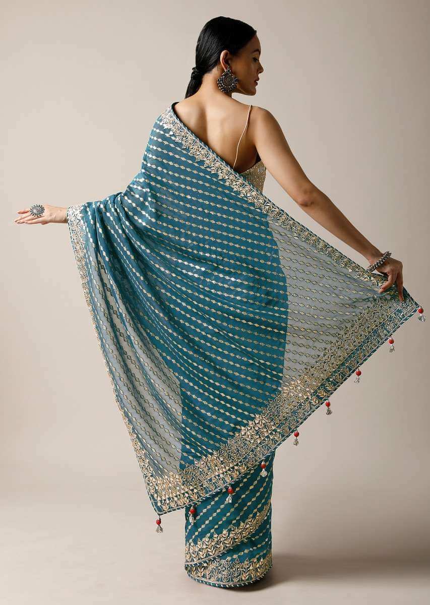 Peacock Green Saree In Brocade Silk With Woven Stripes And Gotta Embroidered Border Along With Unstitched Blouse Online - Kalki Fashion