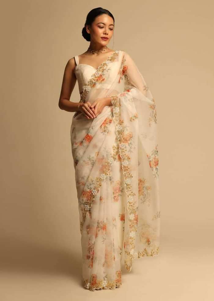 Pearl White Saree In Organza With Floral Print All Over And Moti Embroidered Border Along With Unstitched Blouse