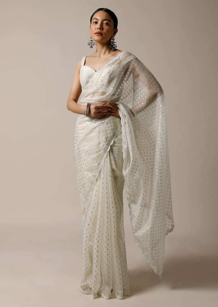 Pearl White Saree In Organza With Foil Printed Buttis And Mirror Work On The Border Along With Unstitched Blouse