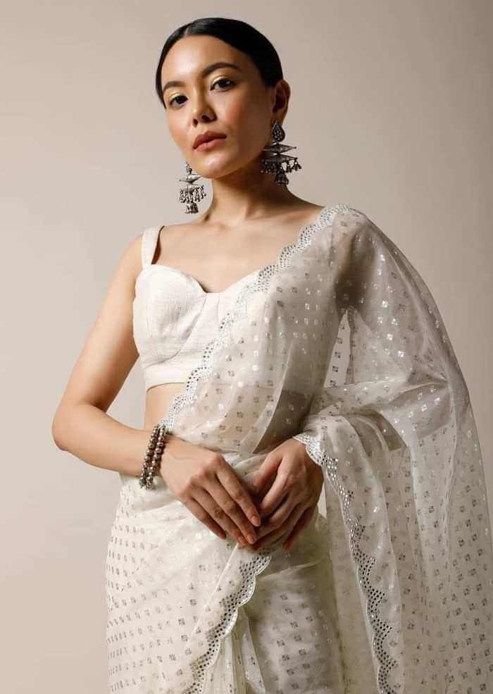 Pearl White Saree In Organza With Foil Printed Buttis And Mirror Work On The Border Along With Unstitched Blouse