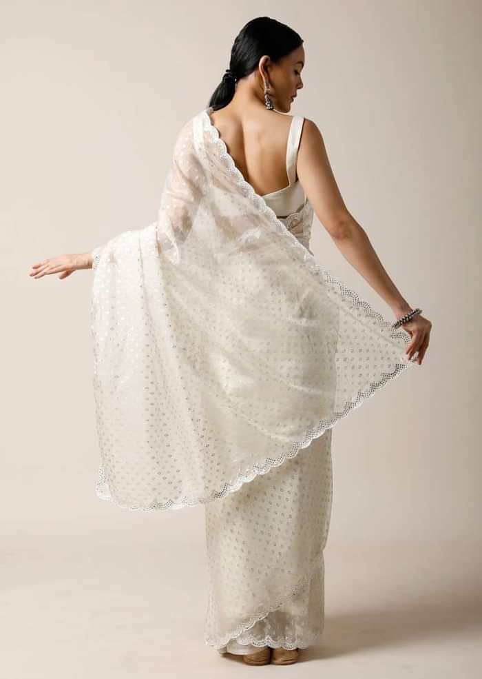 Pearl White Saree In Organza With Foil Printed Buttis And Mirror Work On The Border Along With Unstitched Blouse
